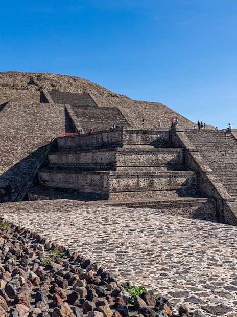 People climbing the Pyramid of the Moon in Teotihuacan, Mexico.