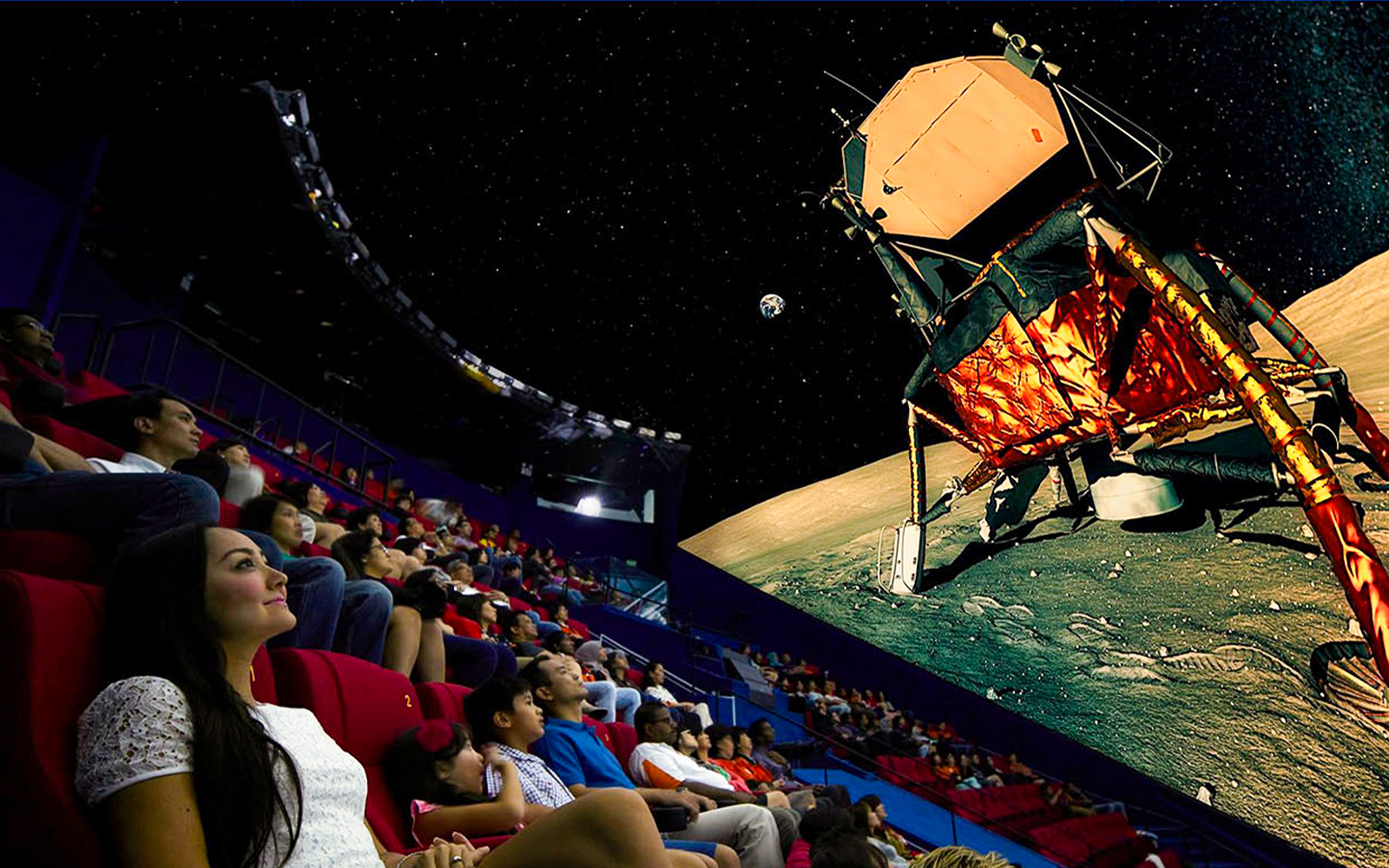 Visitors watching a space-themed show at Science Centre Singapore's planetarium.