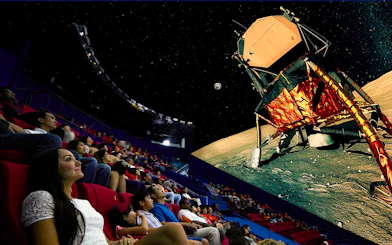 Visitors watching a space-themed show at Science Centre Singapore's planetarium.