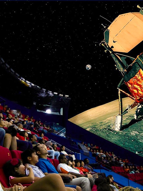 Visitors watching a space-themed show at Science Centre Singapore's planetarium.