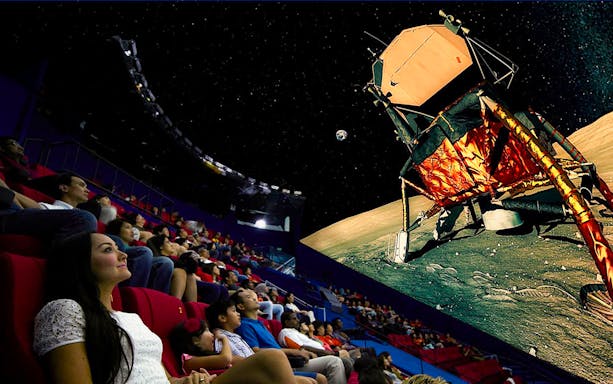 Visitors watching a space-themed show at Science Centre Singapore's planetarium.