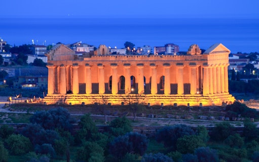 Valley of Temples illuminated at night in Agrigento, Sicily.
