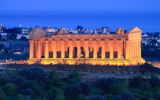 Valley of Temples illuminated at night in Agrigento, Sicily.
