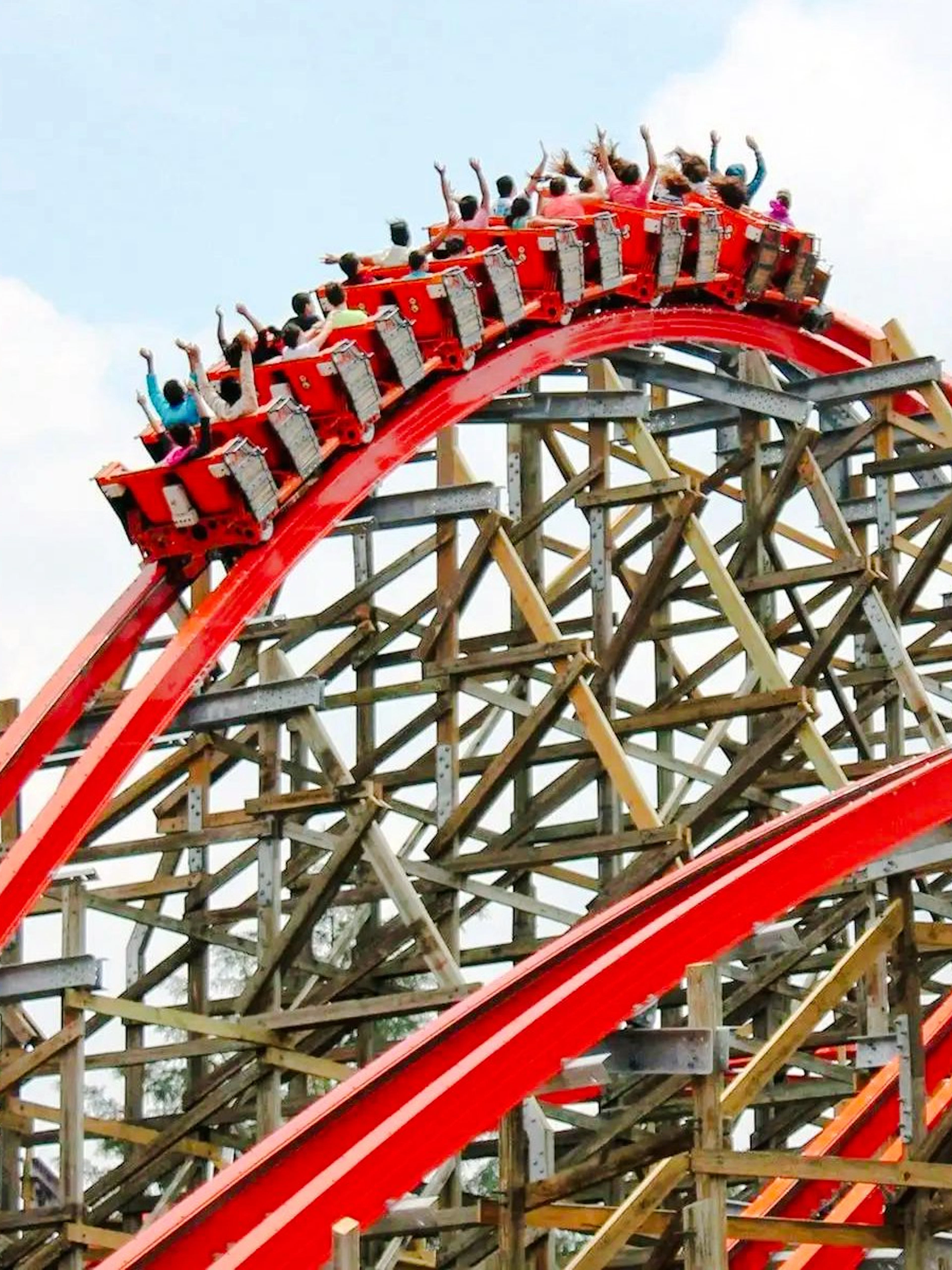 Medusa Steel Coaster at Six Flags Mexico with riders on a red track loop.