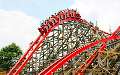 Medusa Steel Coaster at Six Flags Mexico with riders on a red track loop.