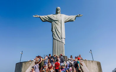 Crowd gathered at the base of Christ the Redeemer statue in Rio de Janeiro, Brazil.