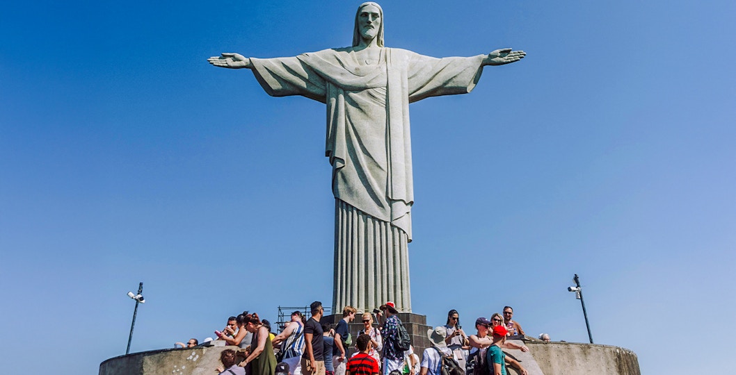 Crowd gathered at the base of Christ the Redeemer statue in Rio de Janeiro, Brazil.