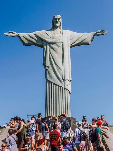 Crowd gathered at the base of Christ the Redeemer statue in Rio de Janeiro, Brazil.