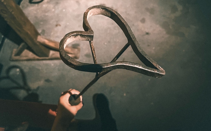 Heart-shaped branding iron at Medieval Torture Museum exhibit.