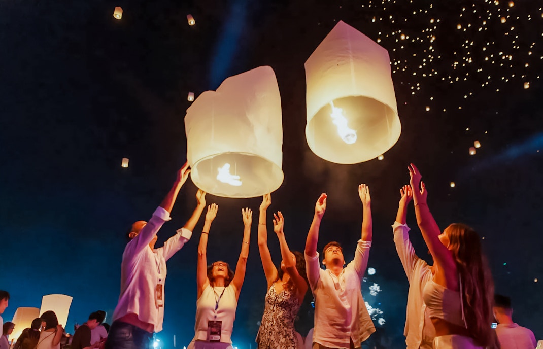 Tourists releasing lanterns at Yipeng Lantern Festival, Chiang Mai, Thailand.