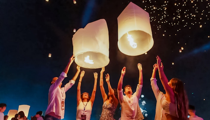Tourists releasing lanterns at Yipeng Lantern Festival, Chiang Mai, Thailand.