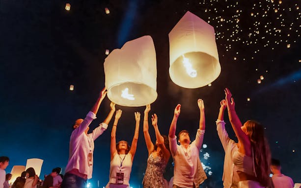 Tourists releasing lanterns at Yipeng Lantern Festival, Chiang Mai, Thailand.