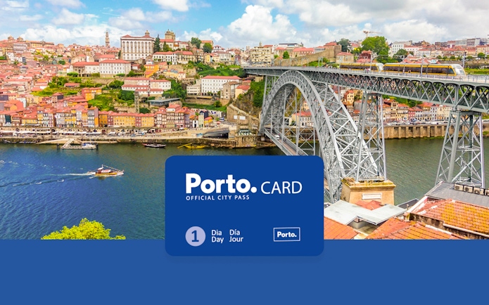 View of Porto's old town with the cathedral, Ponte de Dom Luis I, and colorful buildings along the Duoro River.