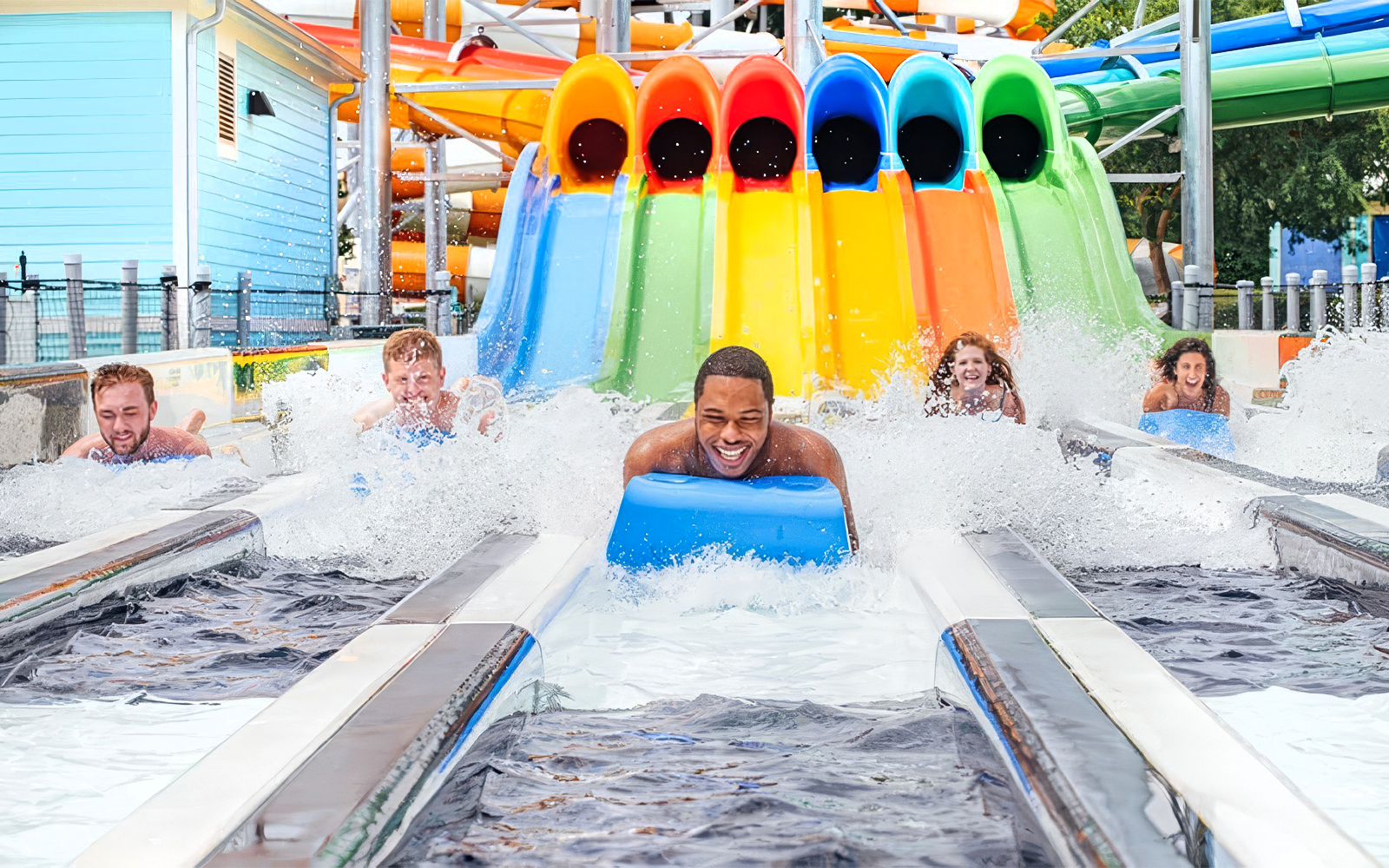 Riders enjoying Boogie Board Racer water slide at Six Flags Carowinds.