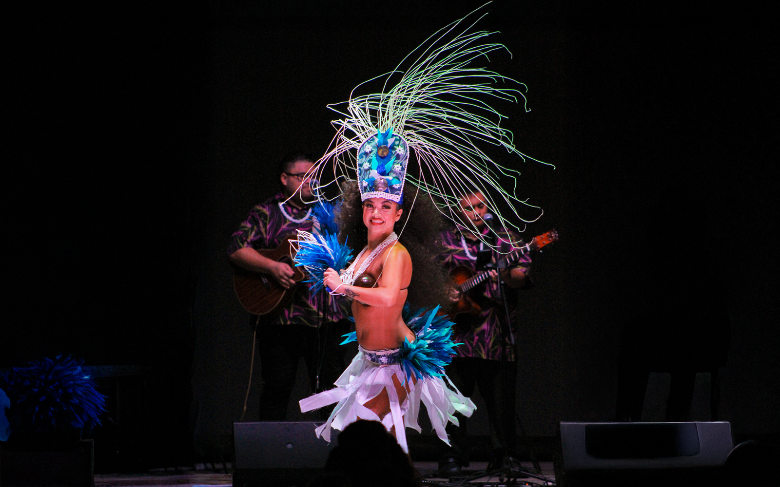 Performer in traditional attire dancing at Moana Luau, Hawaii.