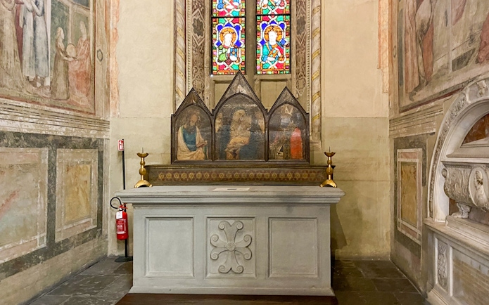 Santa Croce chapel altar with frescoes and stained glass in Florence.