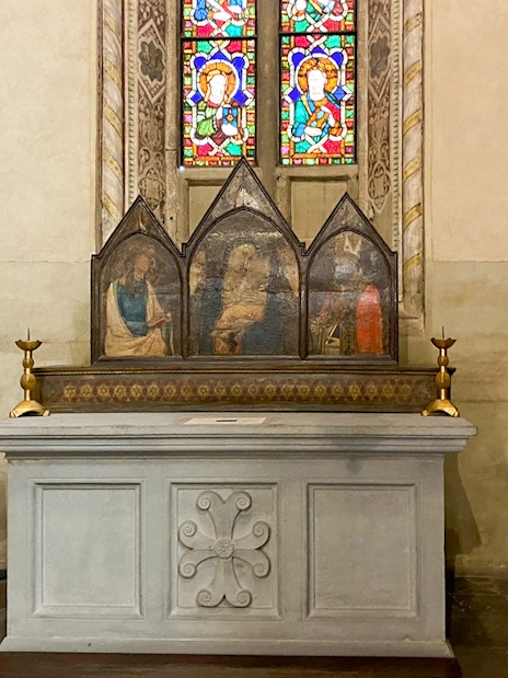 Santa Croce chapel altar with frescoes and stained glass in Florence.