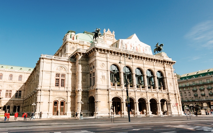 Vienna State Opera building on a sunny day during the Schönbrunn & city tour.