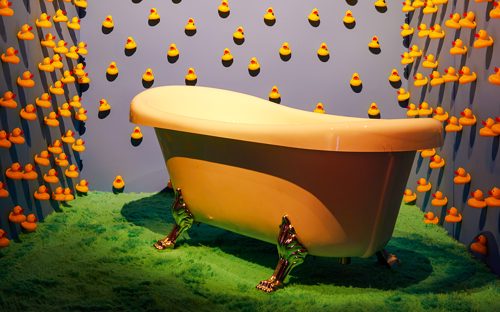 Bathtub surrounded by rubber ducks at Bubble Planet exhibit, Washington DC.