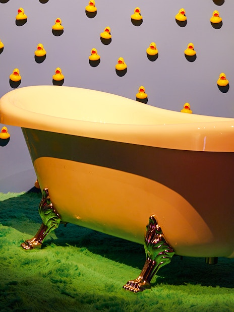 Bathtub surrounded by rubber ducks at Bubble Planet exhibit, Washington DC.