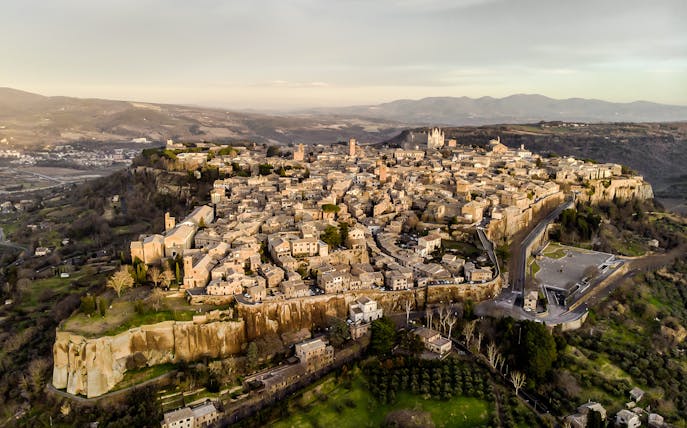 Aerial view of Orvieto, Italy, showcasing historic buildings and surrounding landscape.