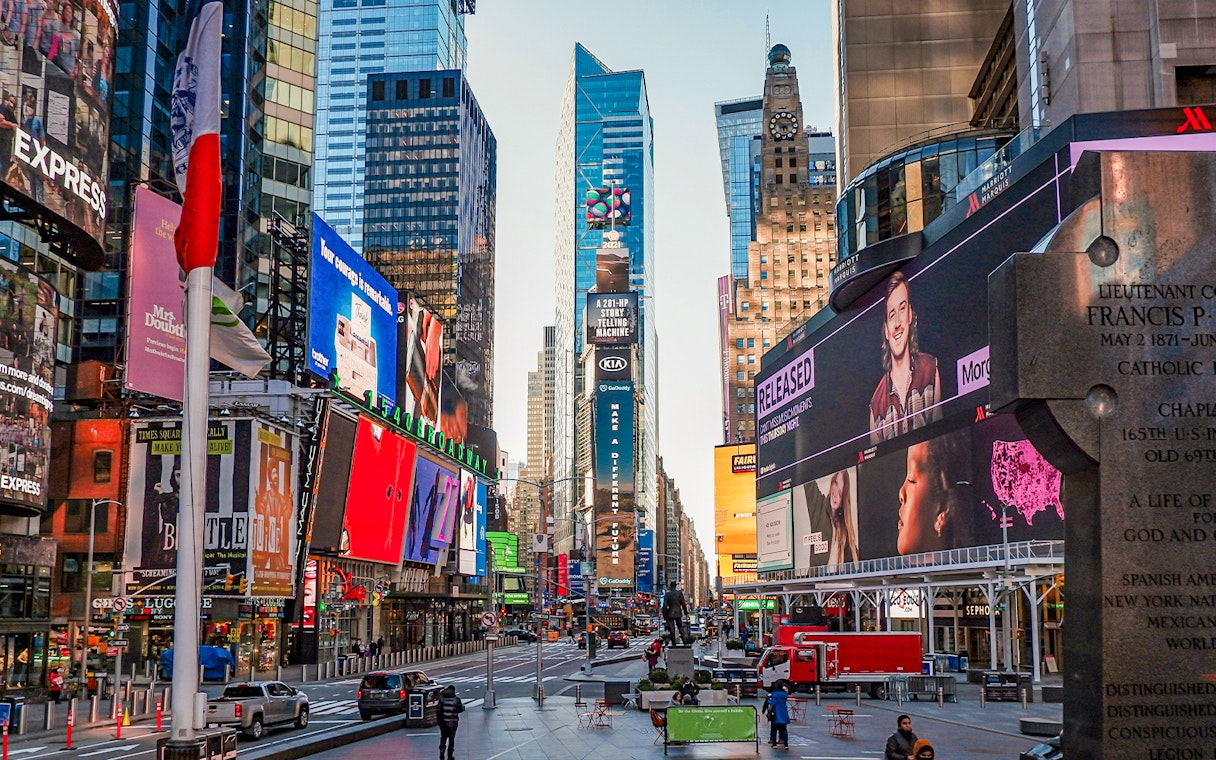 Times Square in New York City with vibrant billboards and bustling street scene.
