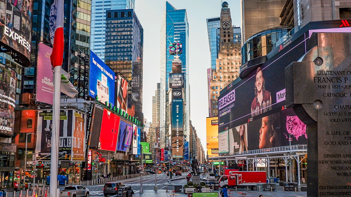 Times Square in New York City with vibrant billboards and bustling street scene.