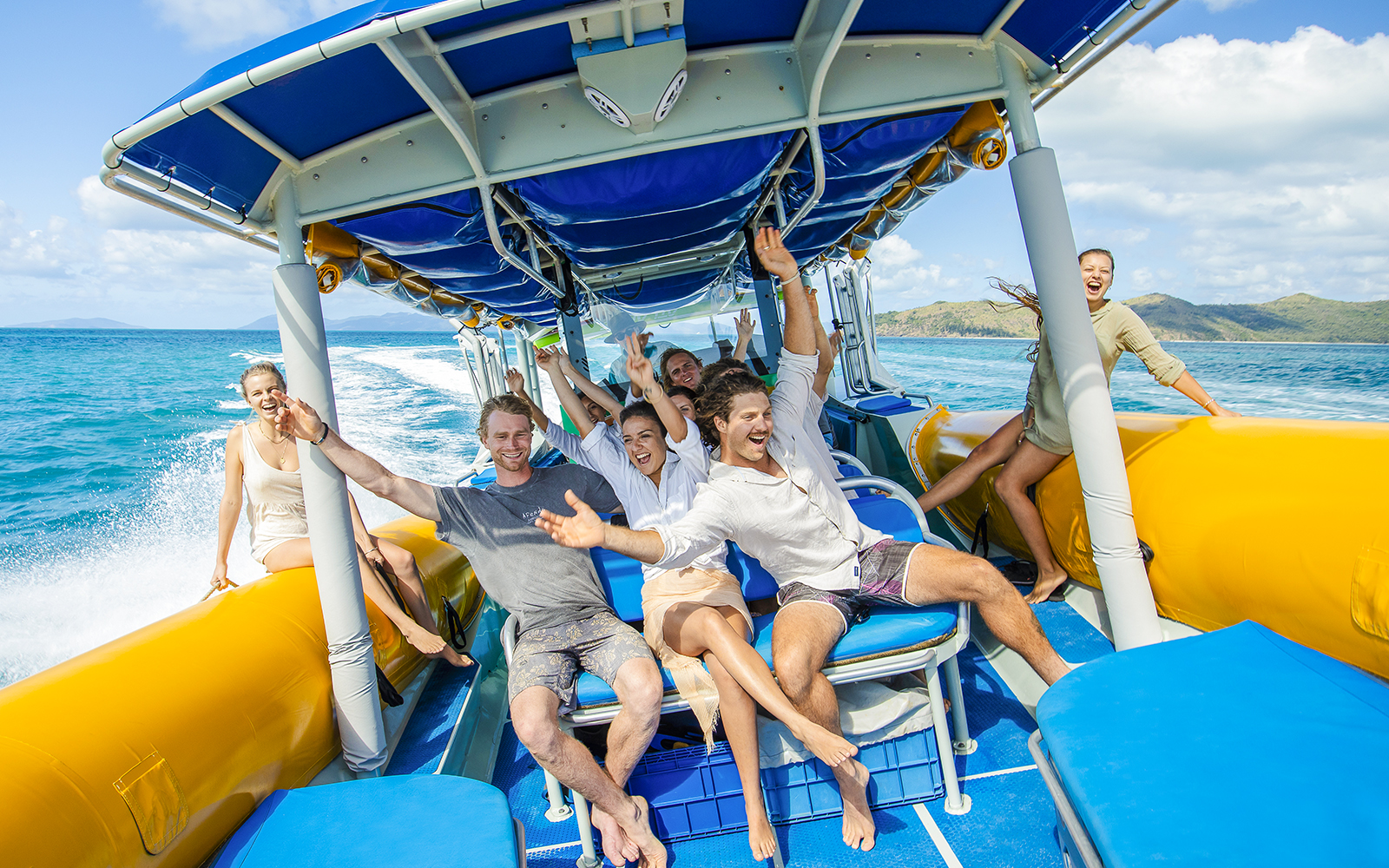 Group enjoying a boat ride on Whitsundays snorkel cruise from Airlie Beach.