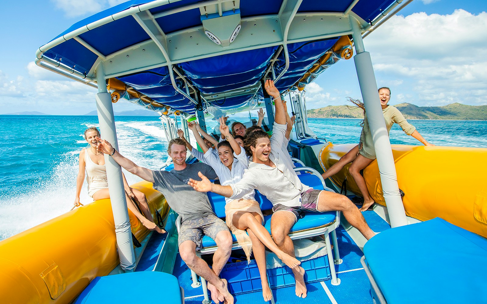 Group enjoying a boat ride on Whitsundays snorkel cruise from Airlie Beach.