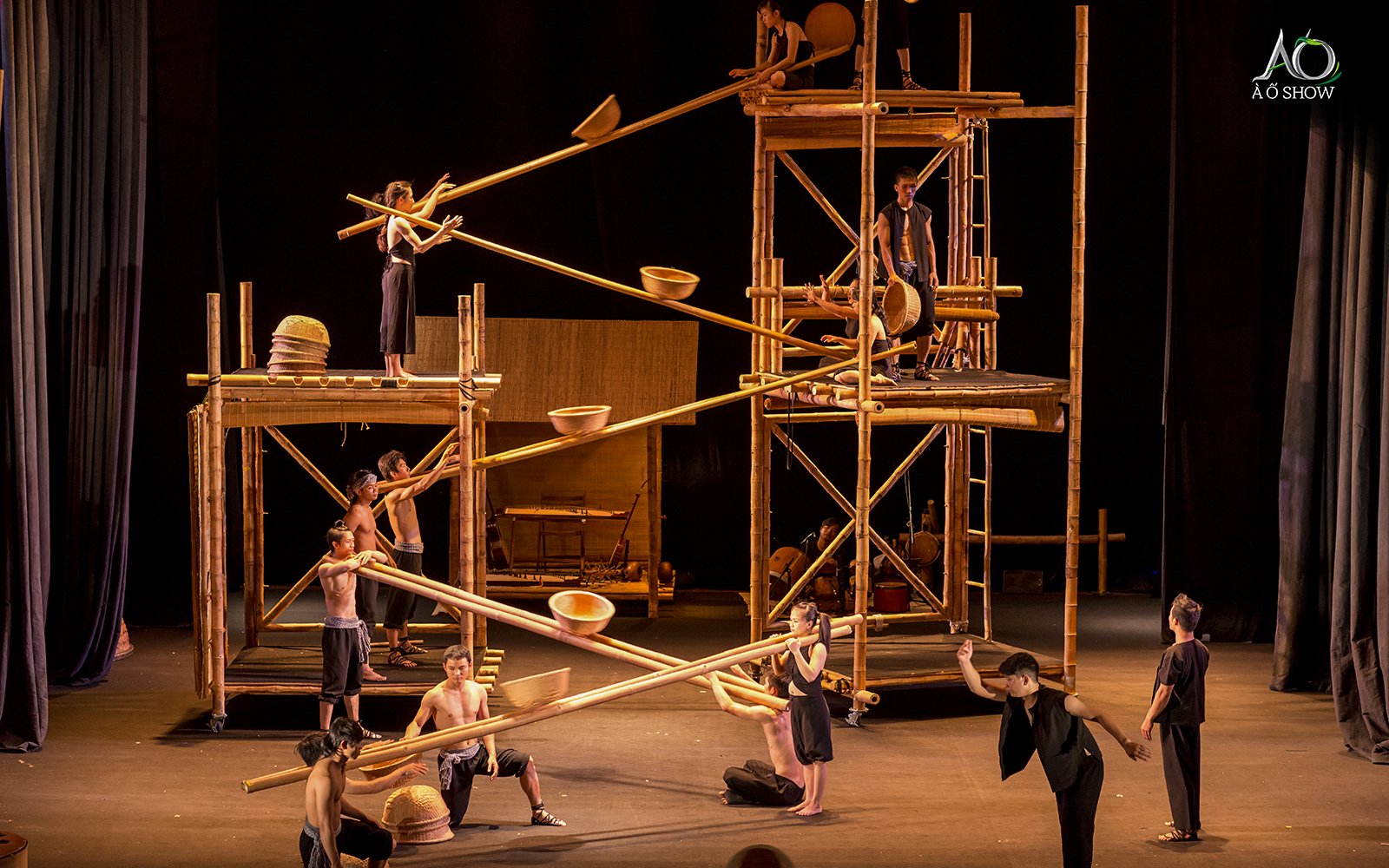 Performers using bamboo scaffolding in a traditional AO show.