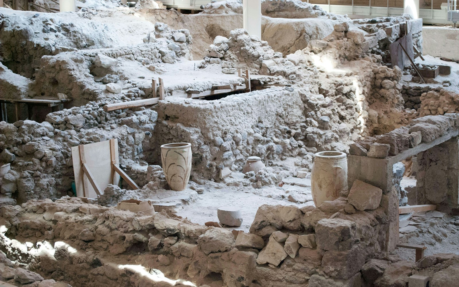 Ancient ruins of Akrotiri, Santorini with pottery artifacts.