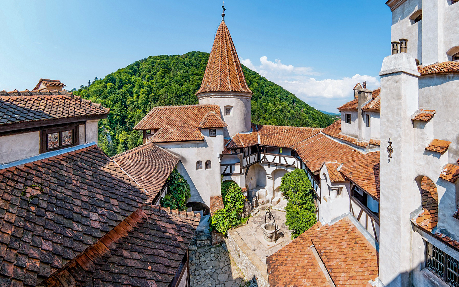 Brasov old town view with red-tiled roofs and medieval architecture during a full day trip.