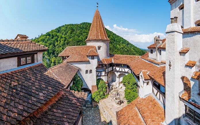 Brasov old town view with red-tiled roofs and medieval architecture during a full day trip.