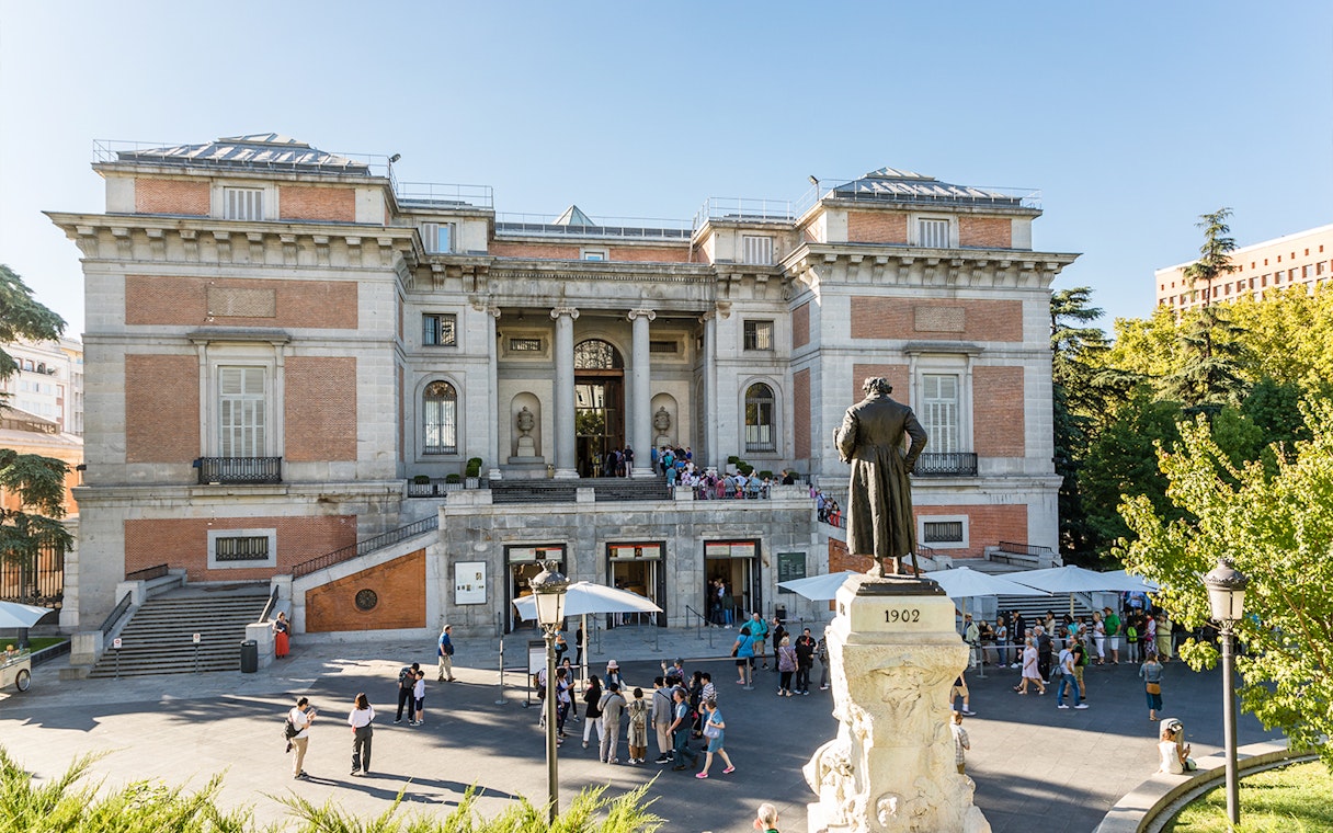 Prado Museum entrance with statue of Philip II in Madrid, Spain.