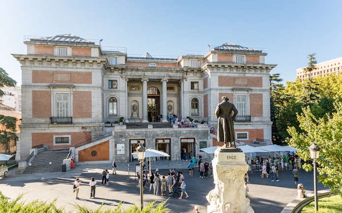 Prado Museum entrance with statue of Philip II in Madrid, Spain.