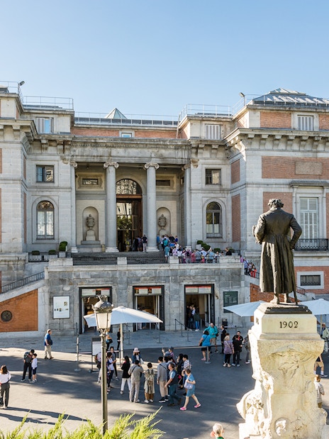 Prado Museum entrance with statue of Philip II in Madrid, Spain.
