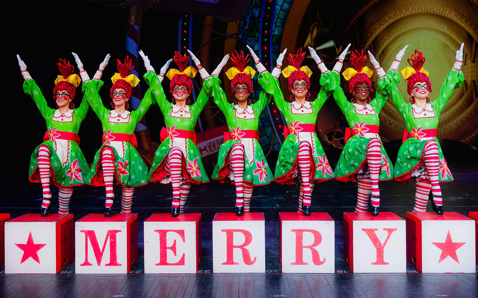 Rockettes performing in festive costumes at Radio City Christmas Spectacular.