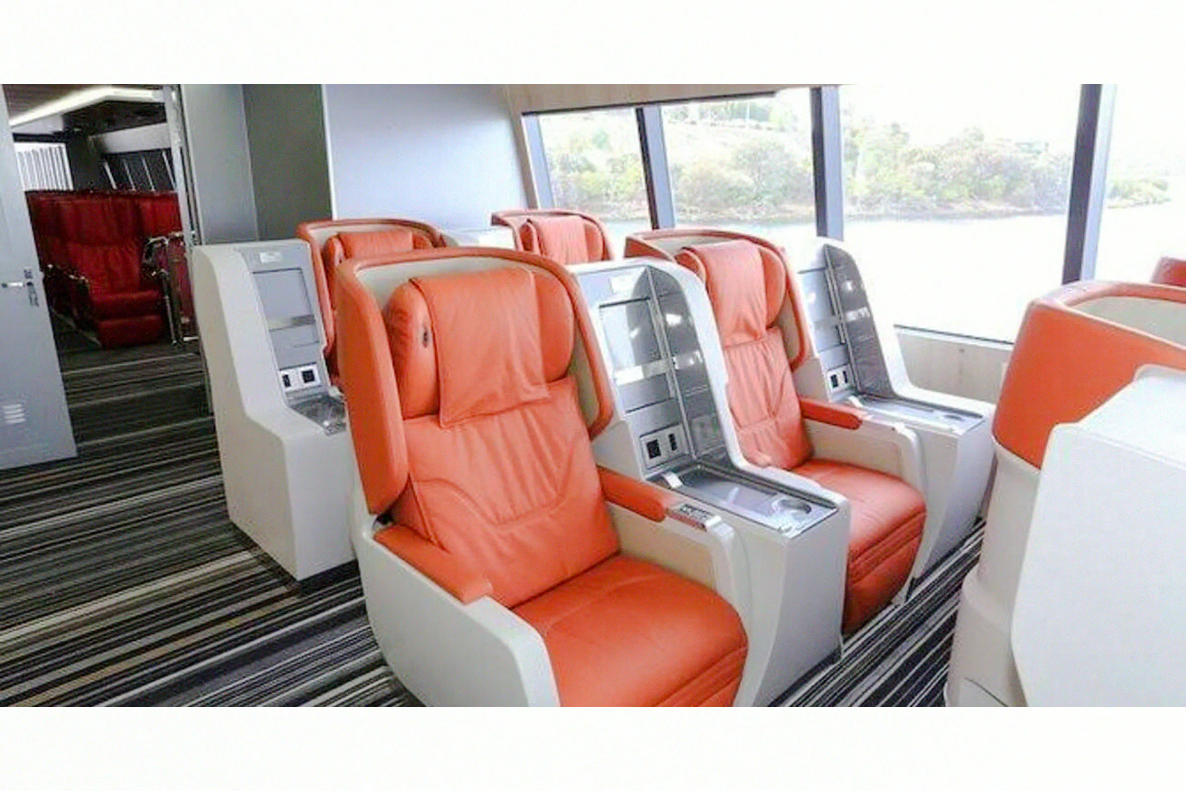 Ferry seating for Zanzibar day trip from Dar es Salaam, featuring comfortable orange seats.