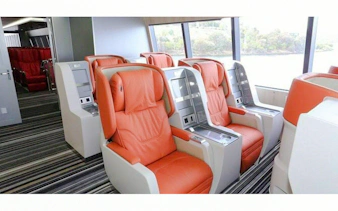 Ferry seating for Zanzibar day trip from Dar es Salaam, featuring comfortable orange seats.