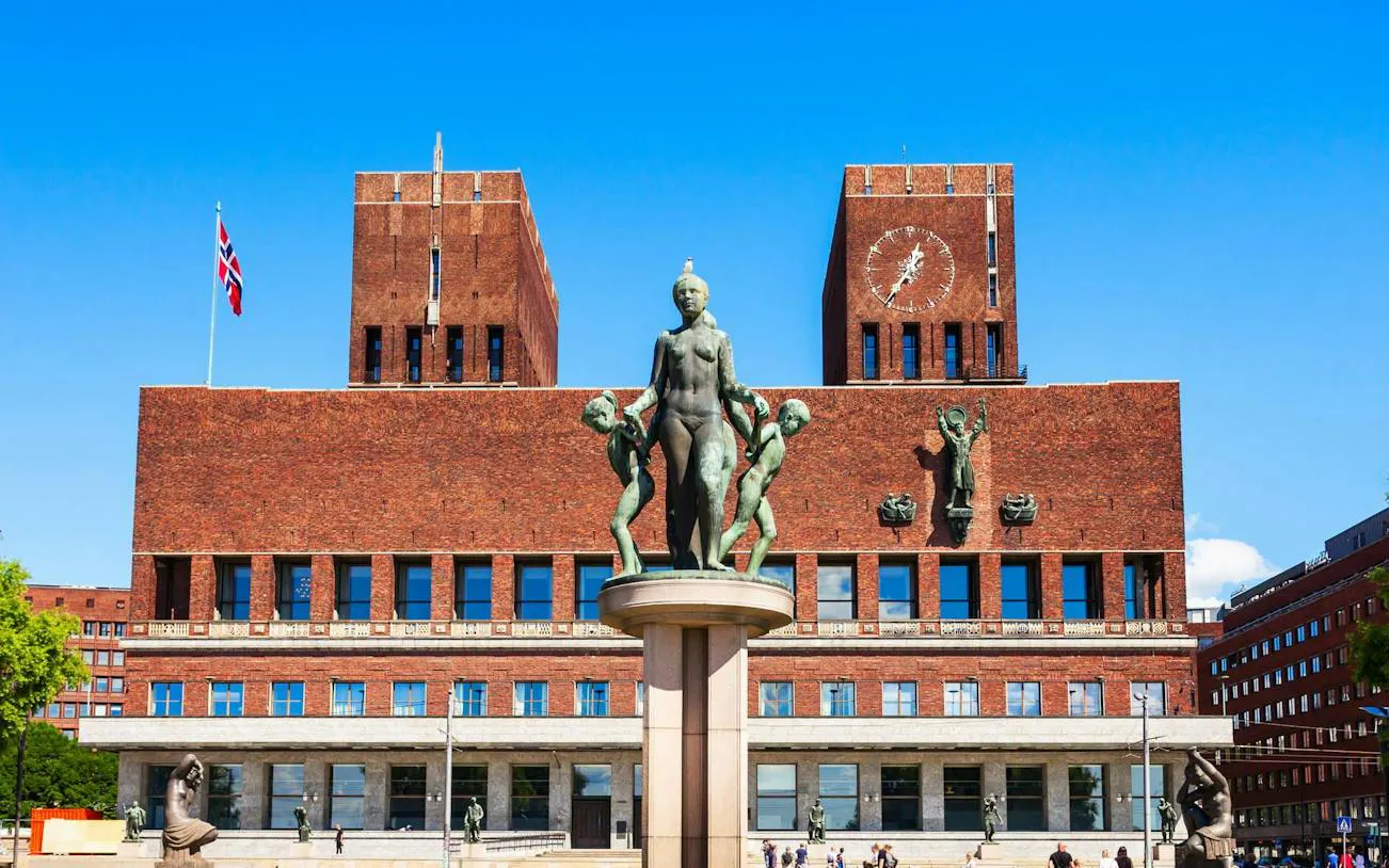 Oslo City Hall with statues in front, part of Oslo Walking Tour.