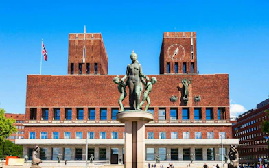 Oslo City Hall with statues in front, part of Oslo Walking Tour.