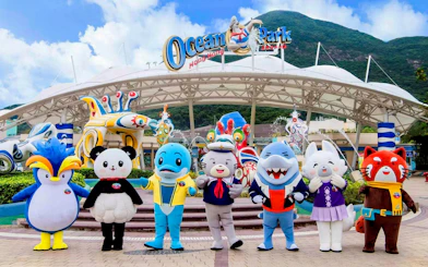 Mascot characters at Ocean Park Hong Kong greeting visitors at the entrance.