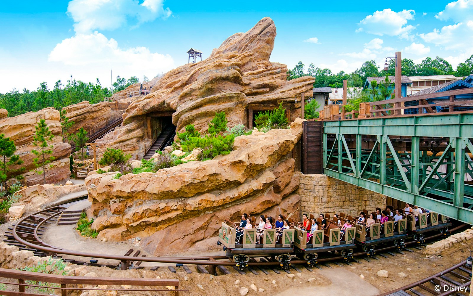 Big Grizzly Mountain Runaway Mine Cars ride at Hong Kong Disneyland with rocky landscape.