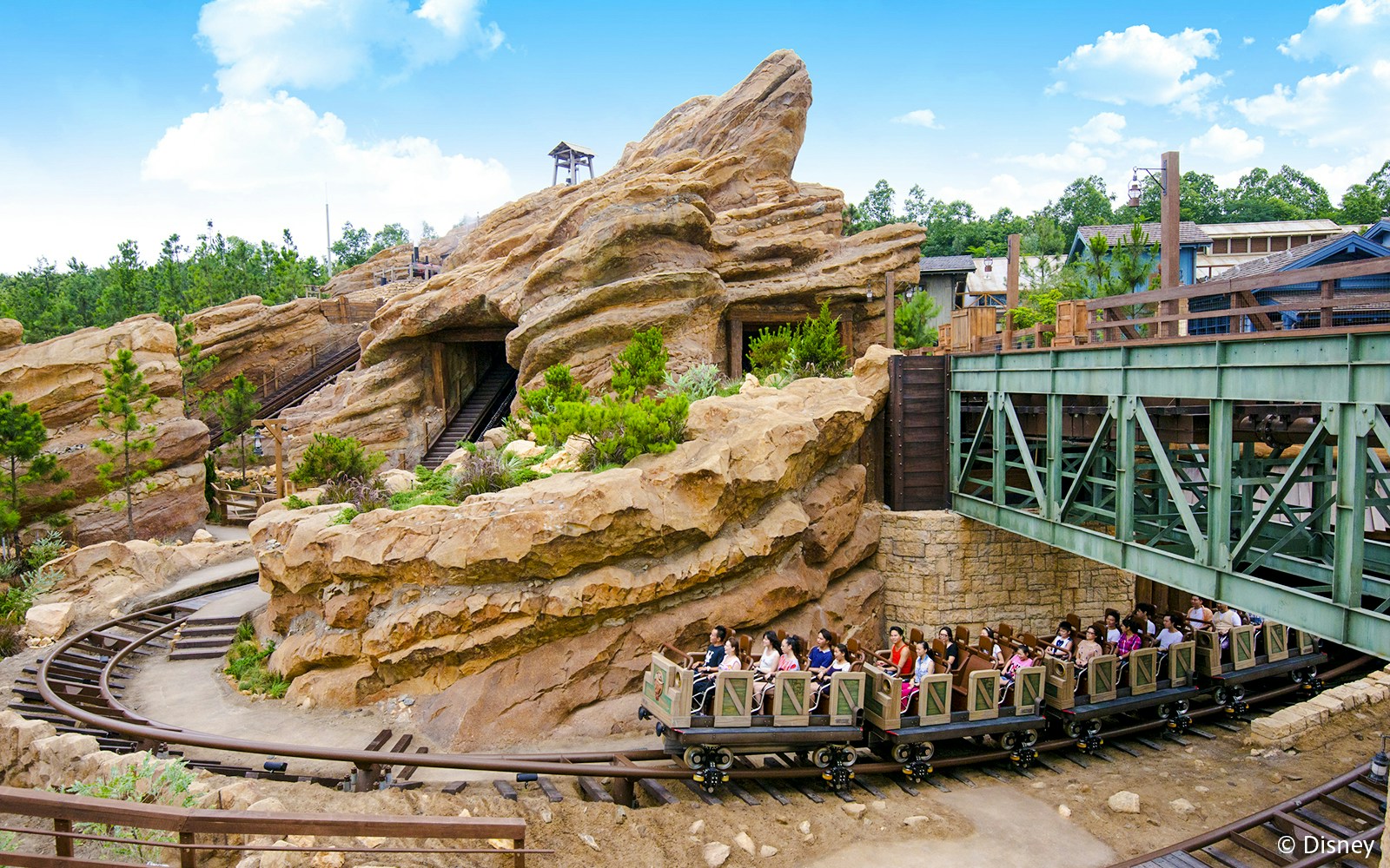 Big Grizzly Mountain Runaway Mine Cars ride at Hong Kong Disneyland with rocky landscape.