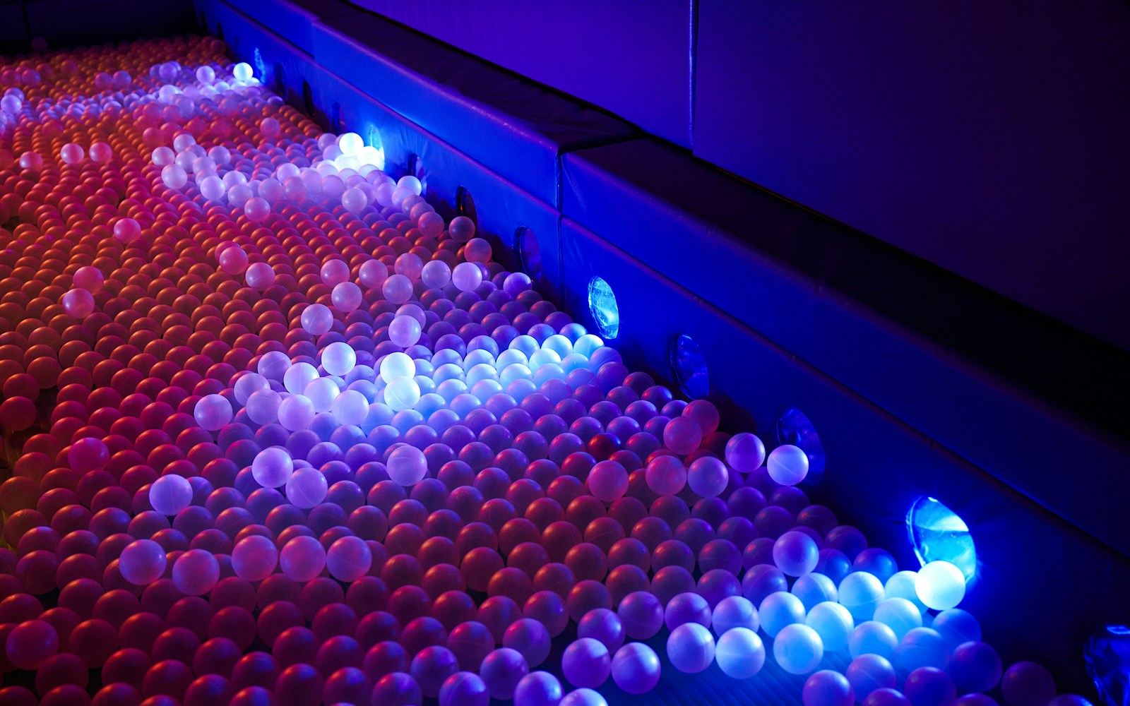 Ball pit with glowing lights at Sunset Lagoon, Dopamine Land.
