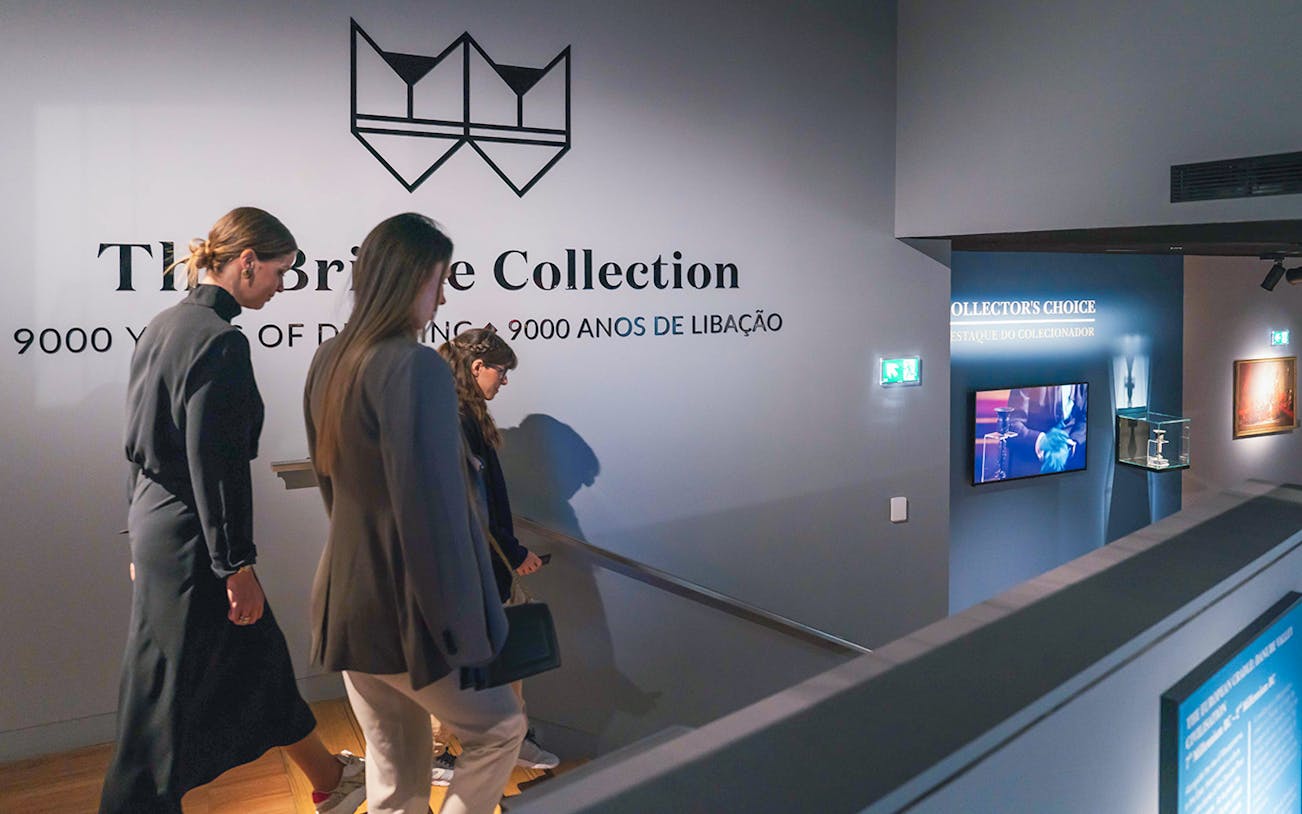 Visitors exploring The Bridge Collection exhibit, showcasing 9000 years of drinking history.