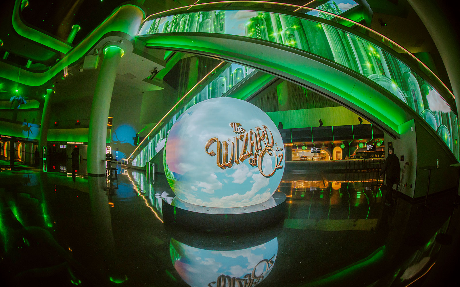 Wizard of Oz show entrance at Sphere with green illuminated decor.