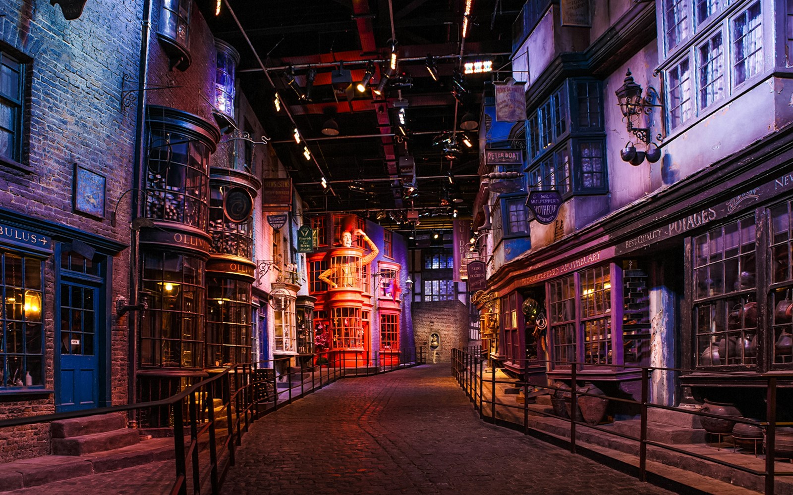 Diagon Alley set during Harry Potter London tour, featuring shopfronts and cobblestone path.