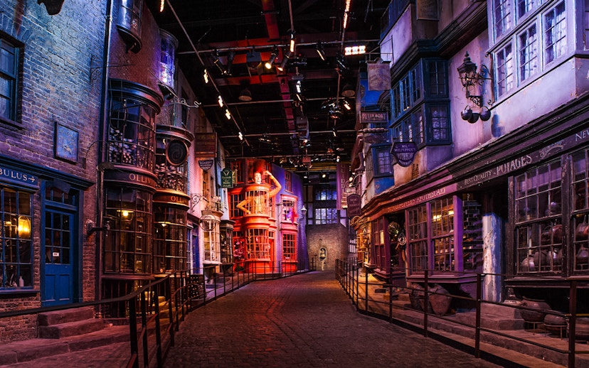 Diagon Alley set during Harry Potter London tour, featuring shopfronts and cobblestone path.