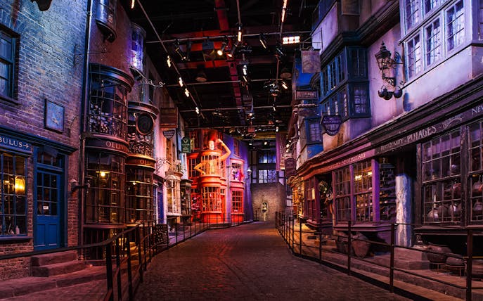 Diagon Alley set during Harry Potter London tour, featuring shopfronts and cobblestone path.